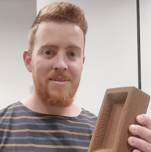 Philip salter holding a bioconcrete brick
